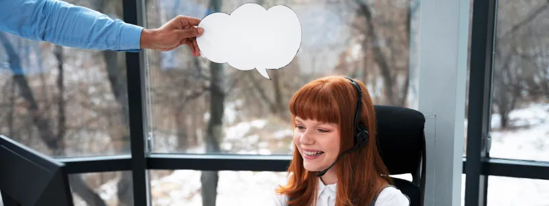 Image of a young woman with a headset talking on a video call